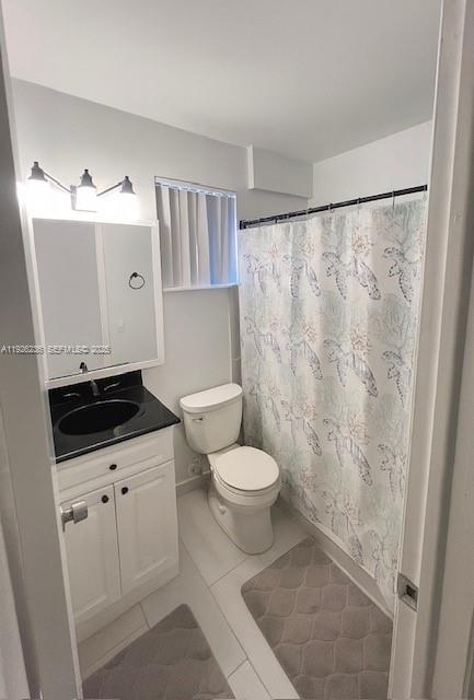 2275 Southwest 15th Street Miami, FL 33145 - Photo 8 of 10 a bathroom with a granite countertop sink a toilet a mirror and a shower