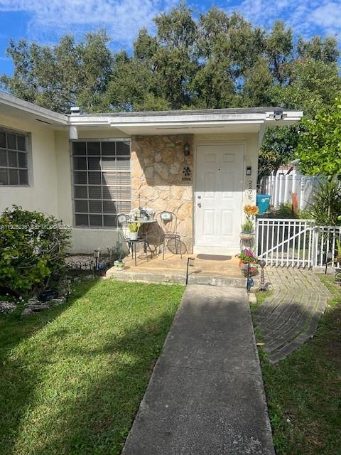 2275 Southwest 15th Street Miami, FL 33145 - Photo 9 of 10 front view of a house with a yard