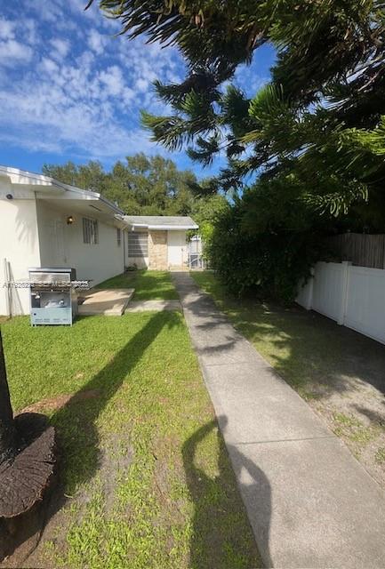 2275 Southwest 15th Street Miami, FL 33145 - Photo 10 of 10 a view of a house with pool and a yard