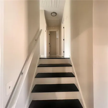 a bathroom with a granite countertop sink toilet and bathtub