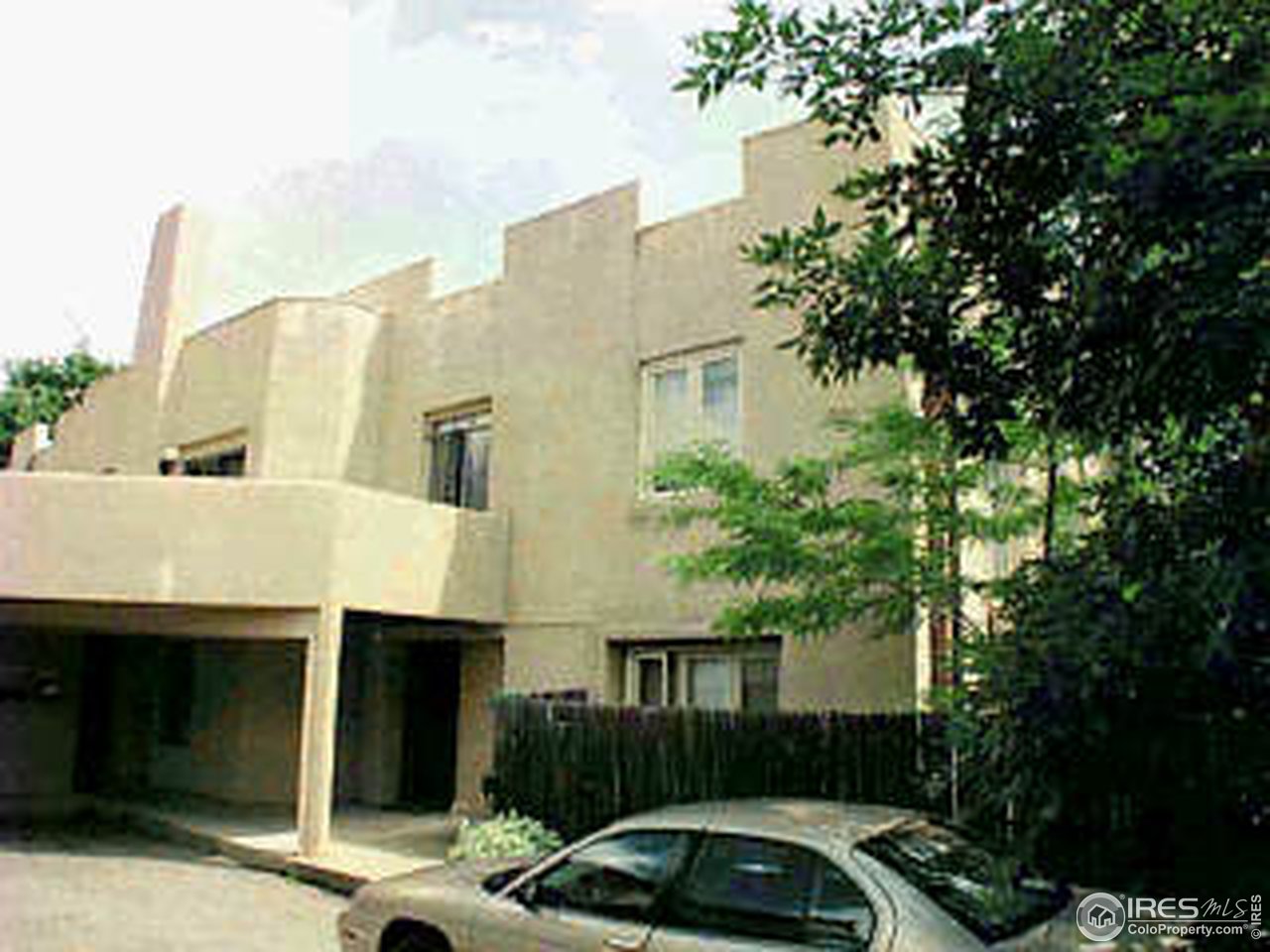 a front view of a house with parking space