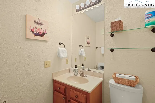 a bathroom with a shower curtain and a toilet