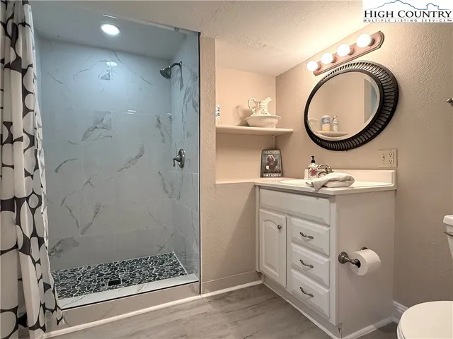 a view of a livingroom with a fan