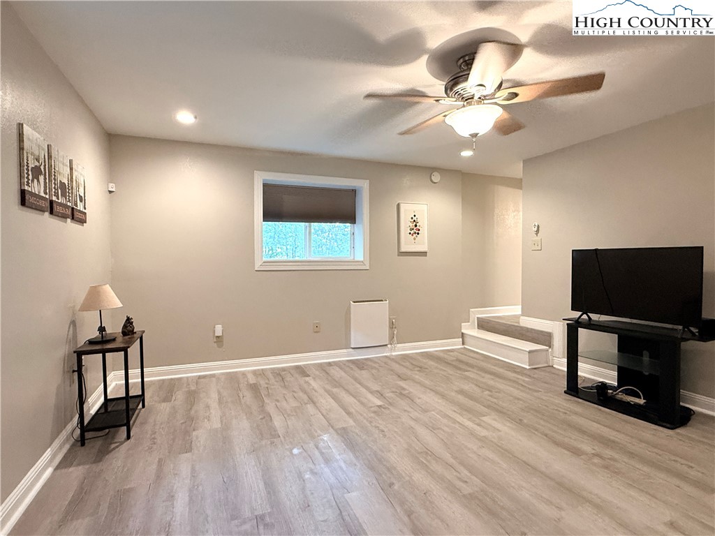 311 Pine Ridge Road Beech Mountain, NC 28604 - Photo 31 of 37 a view of a livingroom with furniture and a flat screen tv