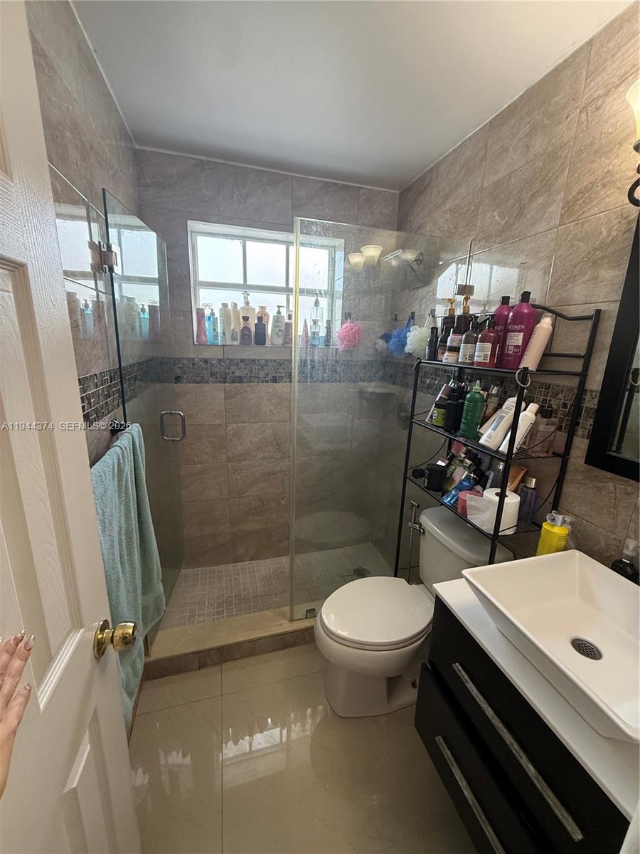 775 East 31st Street Hialeah, FL 33013 - Photo 5 of 11 a bathroom with a sink toilet and shower