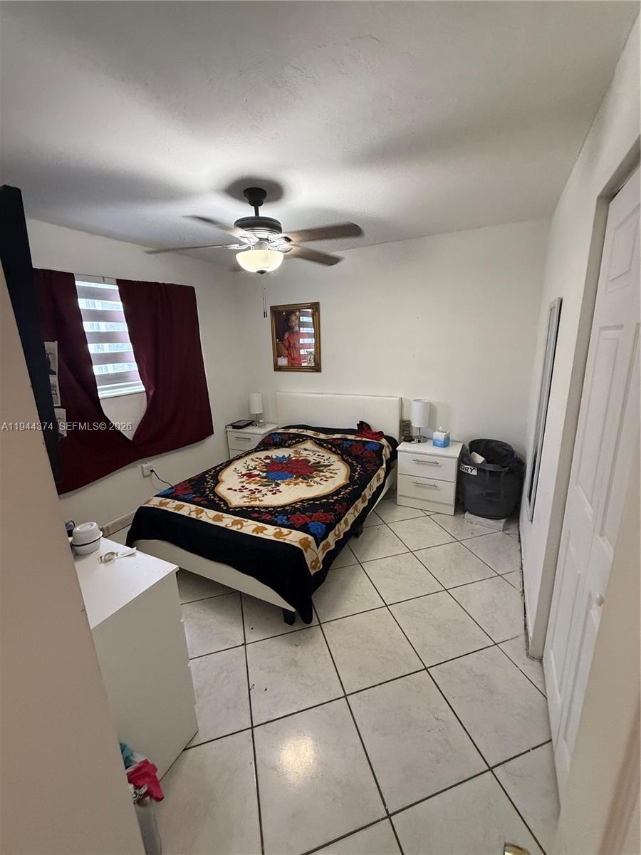 775 East 31st Street Hialeah, FL 33013 - Photo 6 of 11 a living room with hard wood floor and a table