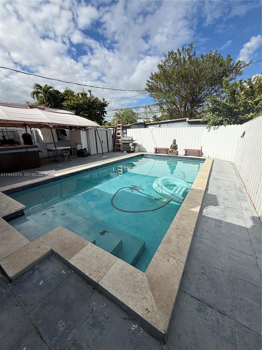 775 East 31st Street Hialeah, FL 33013 - Photo 8 of 11 a view of a house with backyard and patio