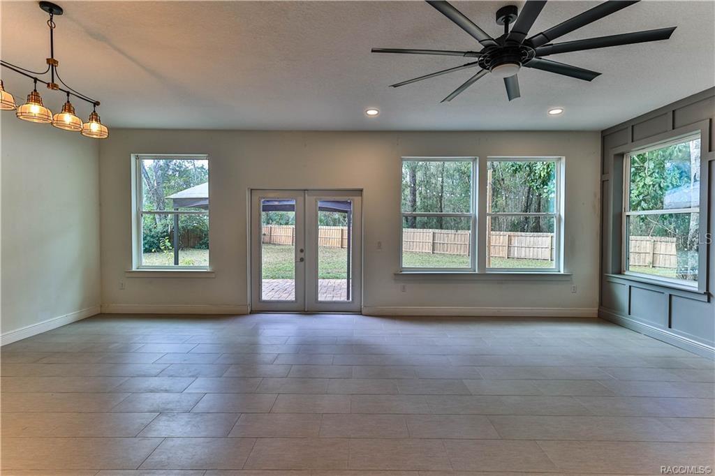 110 North Rooks Avenue Inverness, FL 34453 - Photo 15 of 34 a view of an empty room with a window and wooden floor