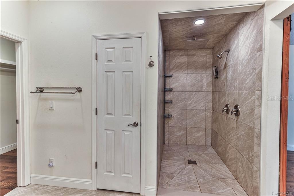 110 North Rooks Avenue Inverness, FL 34453 - Photo 22 of 34 a bathroom with a glass shower door