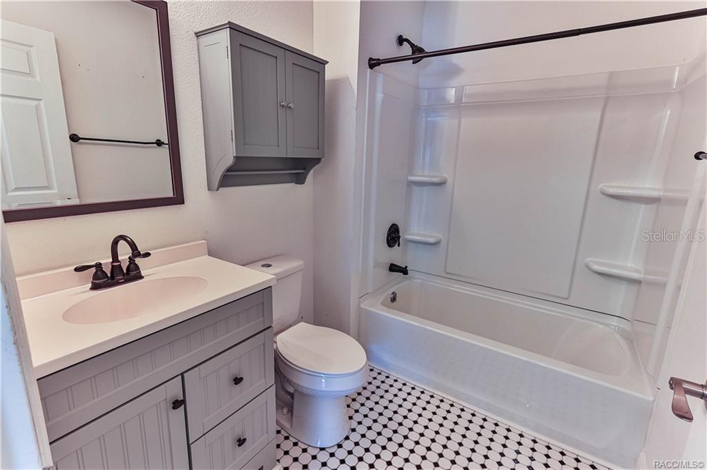 110 North Rooks Avenue Inverness, FL 34453 - Photo 30 of 34 a bathroom with a sink a toilet and shower