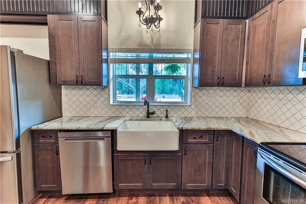 110 North Rooks Avenue Inverness, FL 34453 - Photo 4 of 34 a kitchen with a sink a refrigerator and window