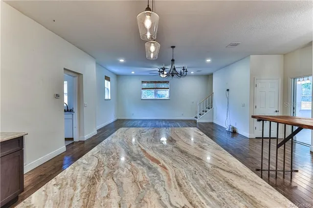 a view of a livingroom with furniture and wooden floor
