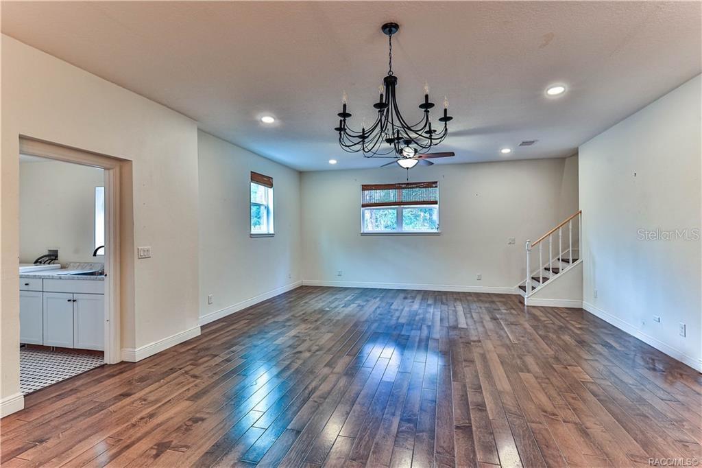 110 North Rooks Avenue Inverness, FL 34453 - Photo 9 of 34 a view of a kitchen with wooden floor and a sink