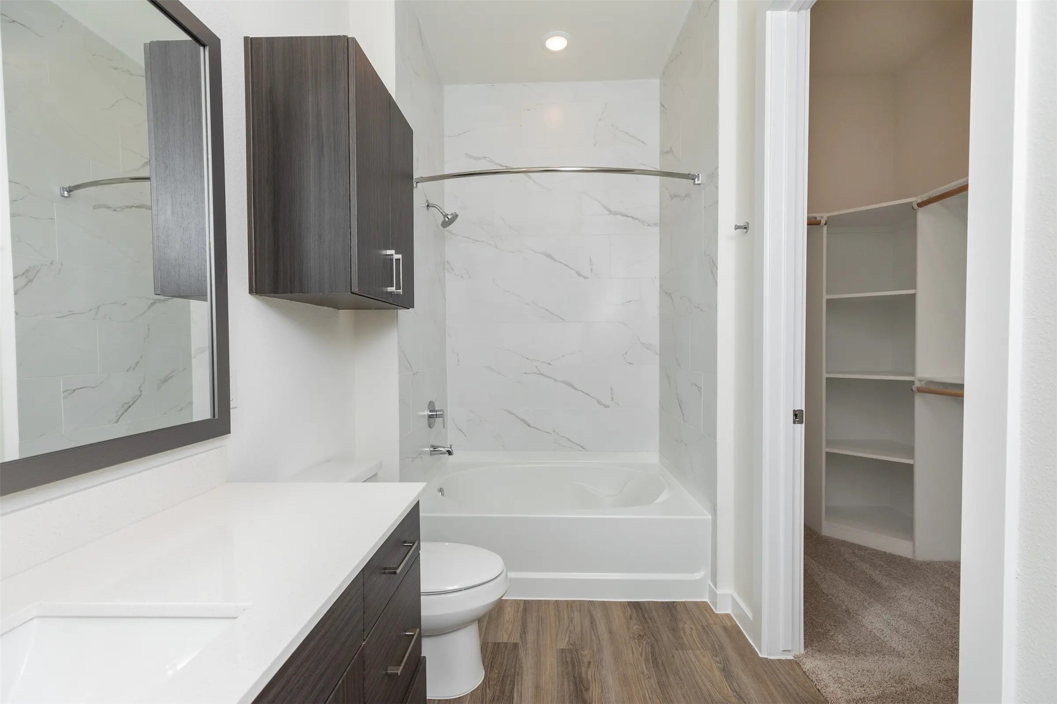 1690 North Loop, Unit 467 Houston, TX 77009 - Photo 13 of 28 a bathroom with a bathtub a toilet and a shower