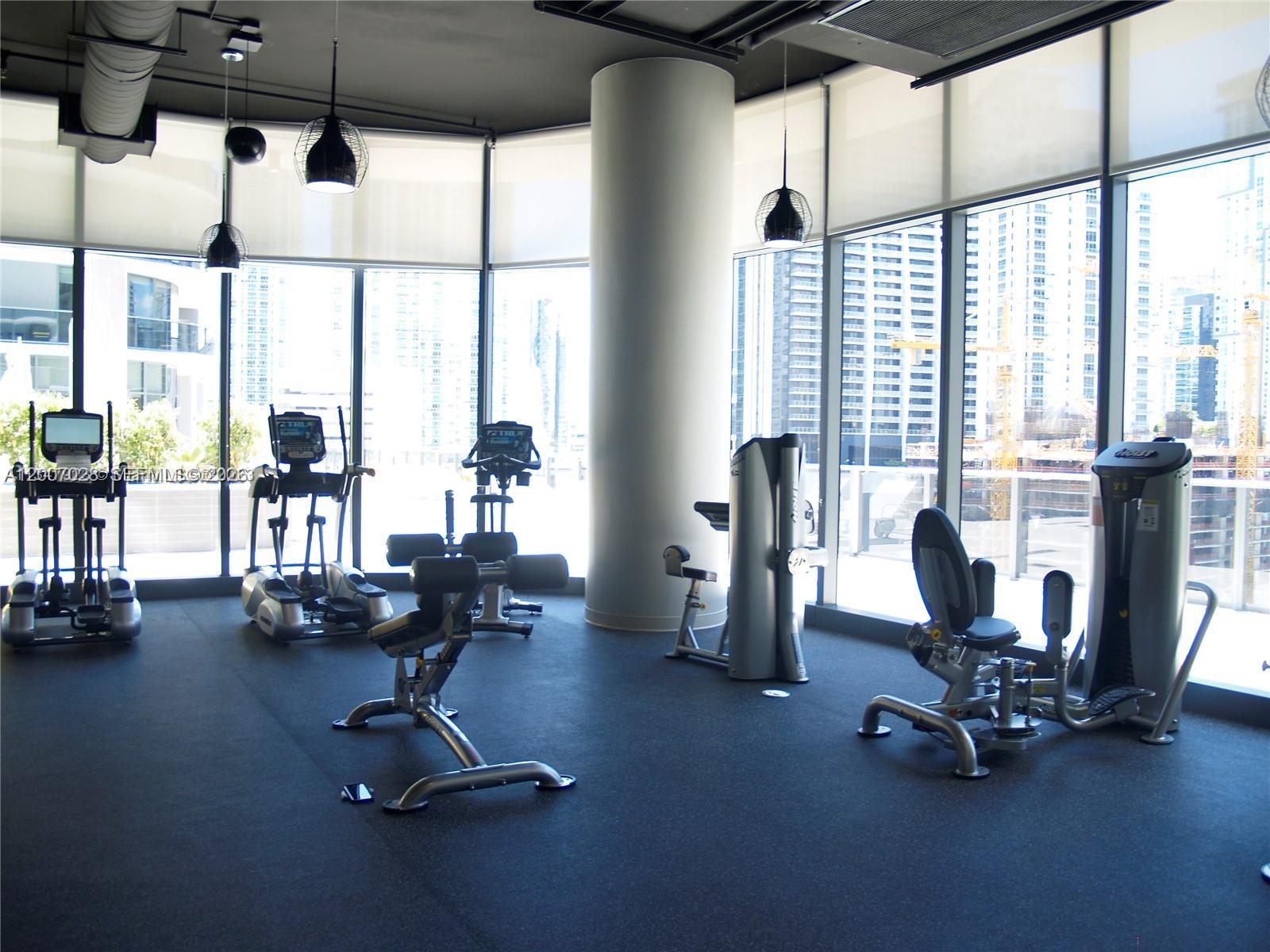 55 Southwest 9th Street, Unit 2502 Miami, FL 33130 - Photo 27 of 27 a view of a room with gym equipment