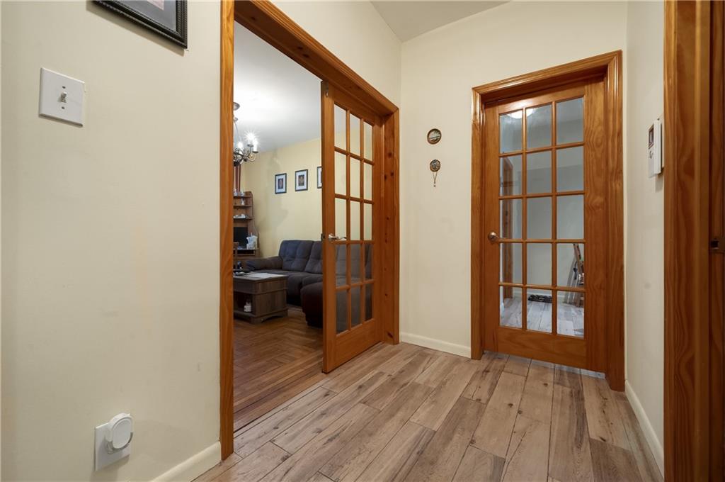 3045 Ocean Parkway, Unit 2D Brooklyn, NY 11235 - Photo 4 of 10 a view of empty room with wooden floor and a window