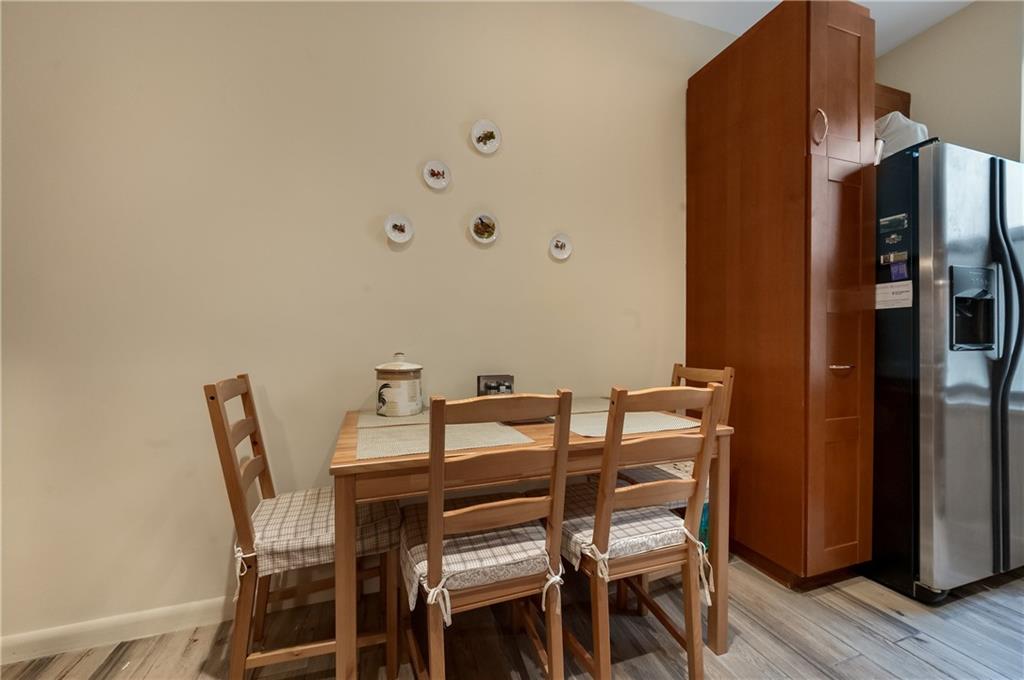 3045 Ocean Parkway, Unit 2D Brooklyn, NY 11235 - Photo 8 of 10 a view of a dining room with furniture and wooden floor