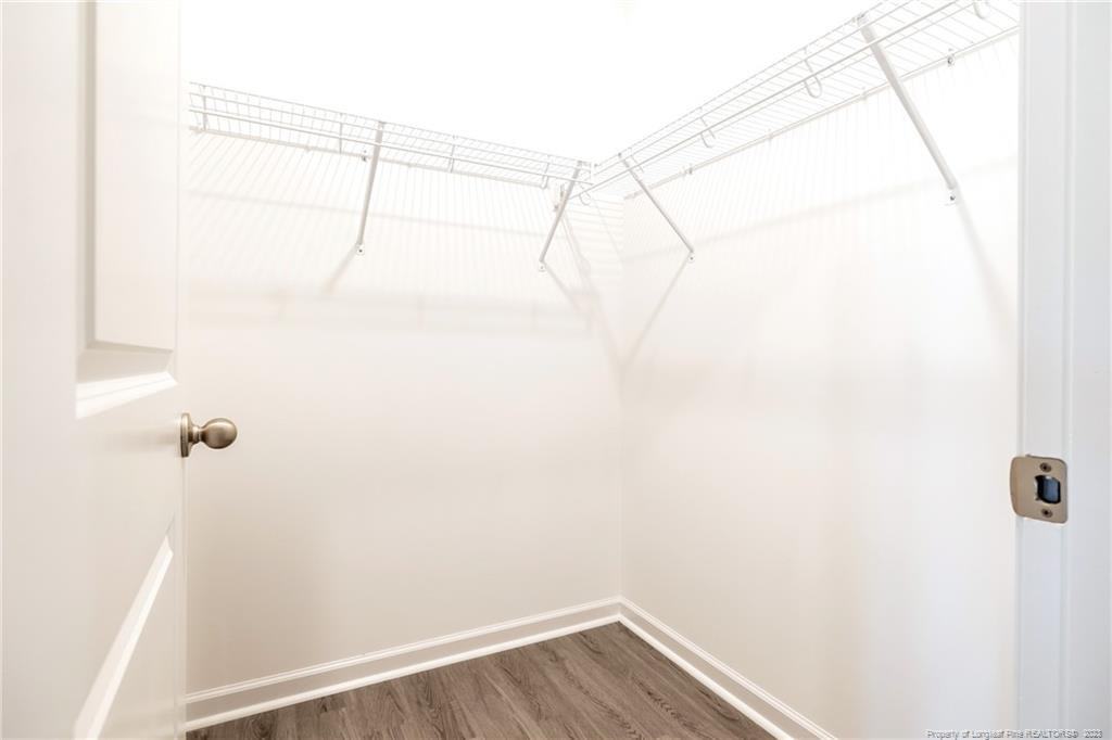 260 Carolina Church Road St. Pauls, NC 28384 - Photo 16 of 32 a view of a room with racks on the wall