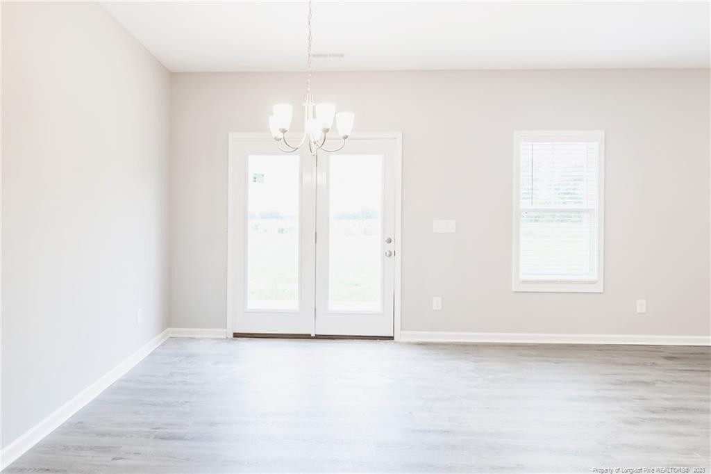 260 Carolina Church Road St. Pauls, NC 28384 - Photo 20 of 32 an empty room with a empty space and windows