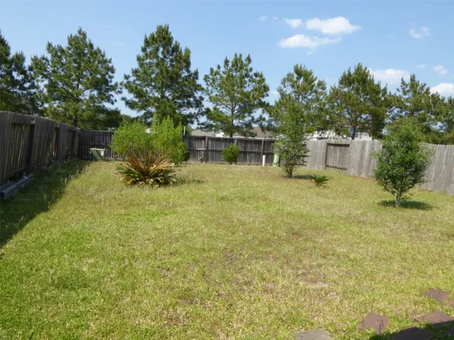 a view of a yard with a slide