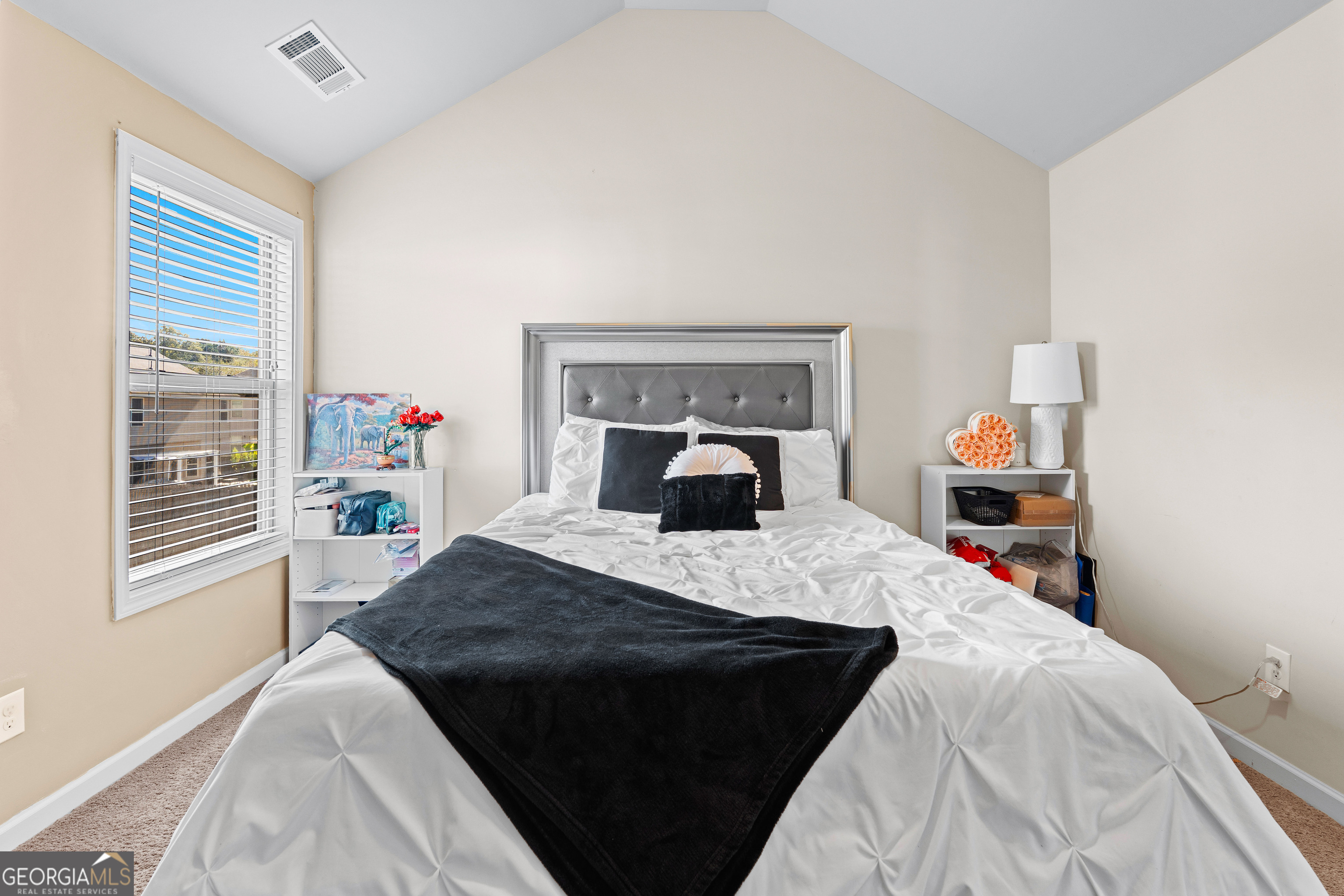 112 Truman Court Jackson, GA 30233 - Photo 27 of 41 a bed sitting in a bedroom next to a window