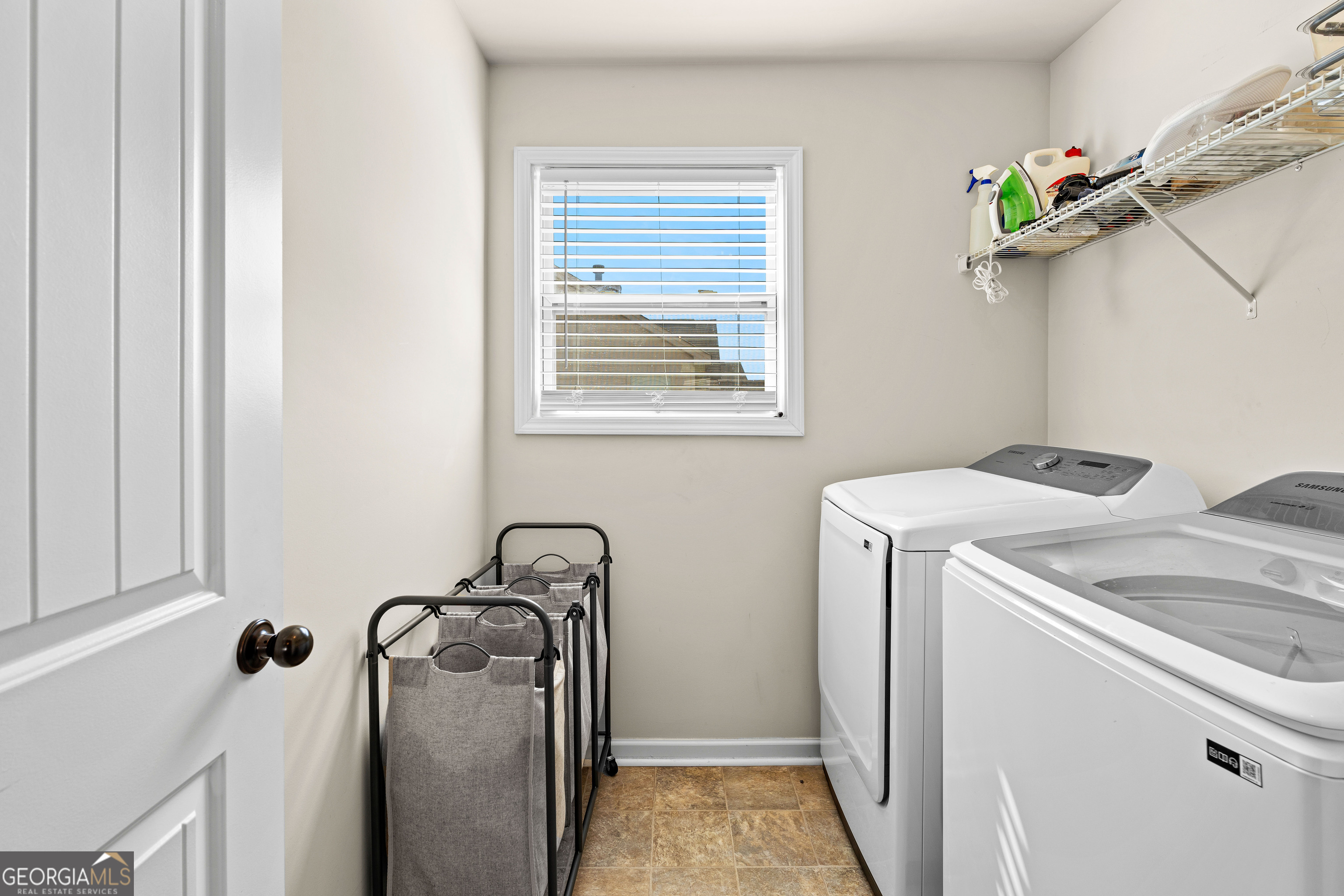 112 Truman Court Jackson, GA 30233 - Photo 28 of 41 a view of storage and utility room with washer and dryer