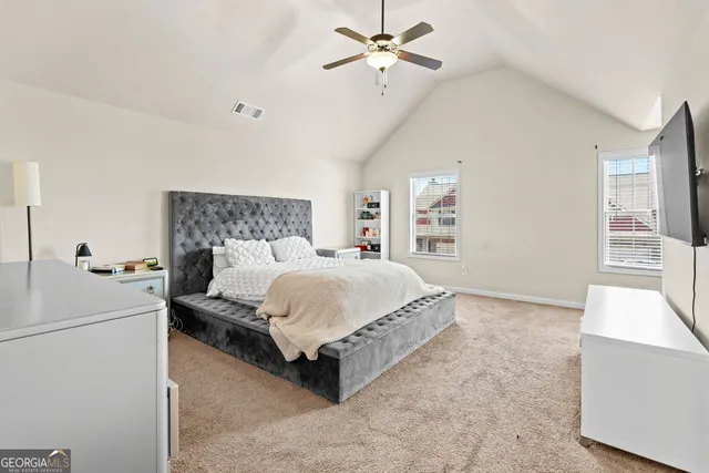 a bed room with a bed and a chandelier