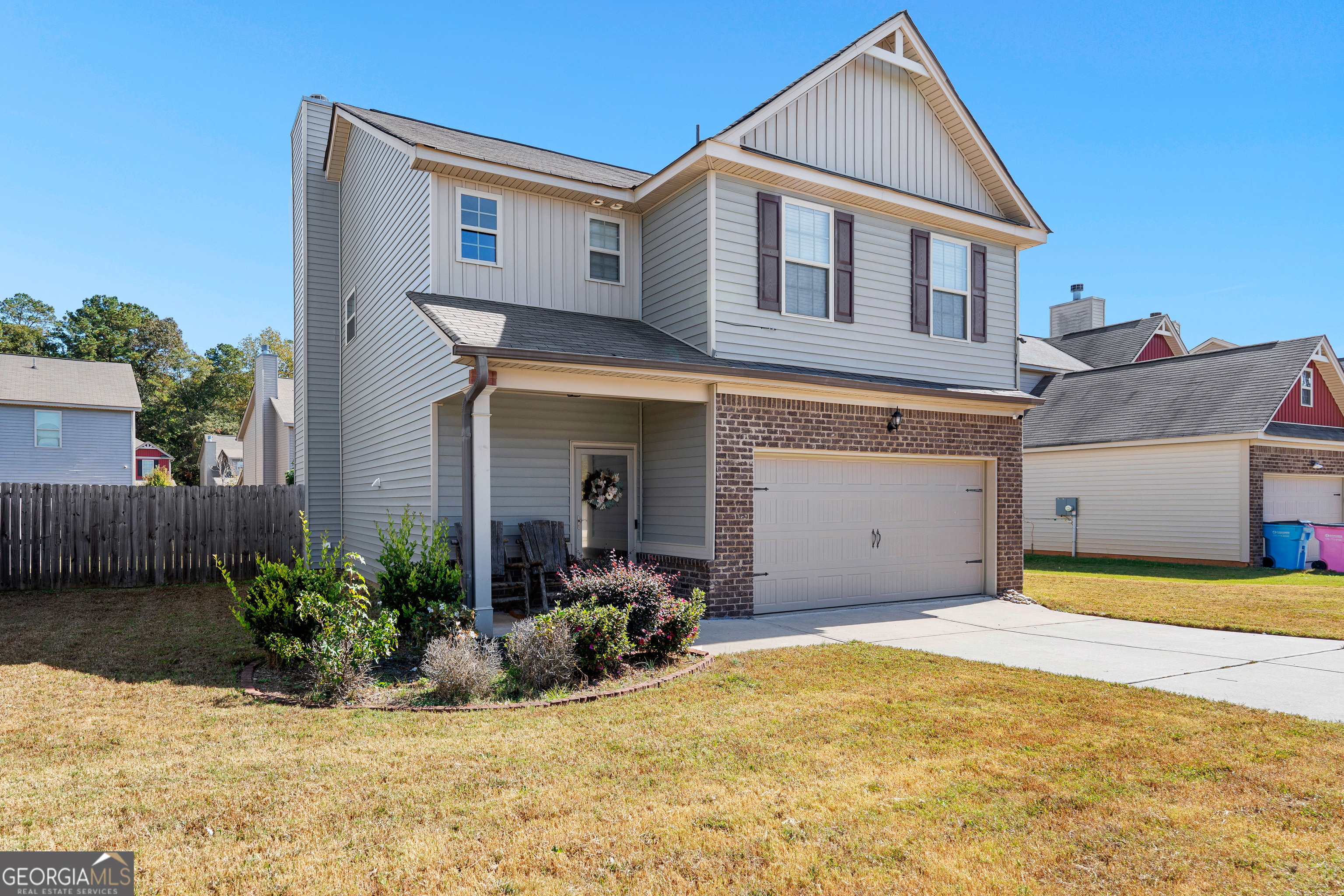 112 Truman Court Jackson, GA 30233 - Photo 3 of 41 a front view of a house with a yard
