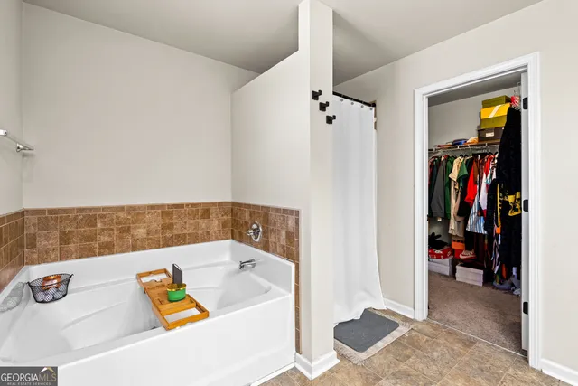 a bath tub sitting next to a bathroom