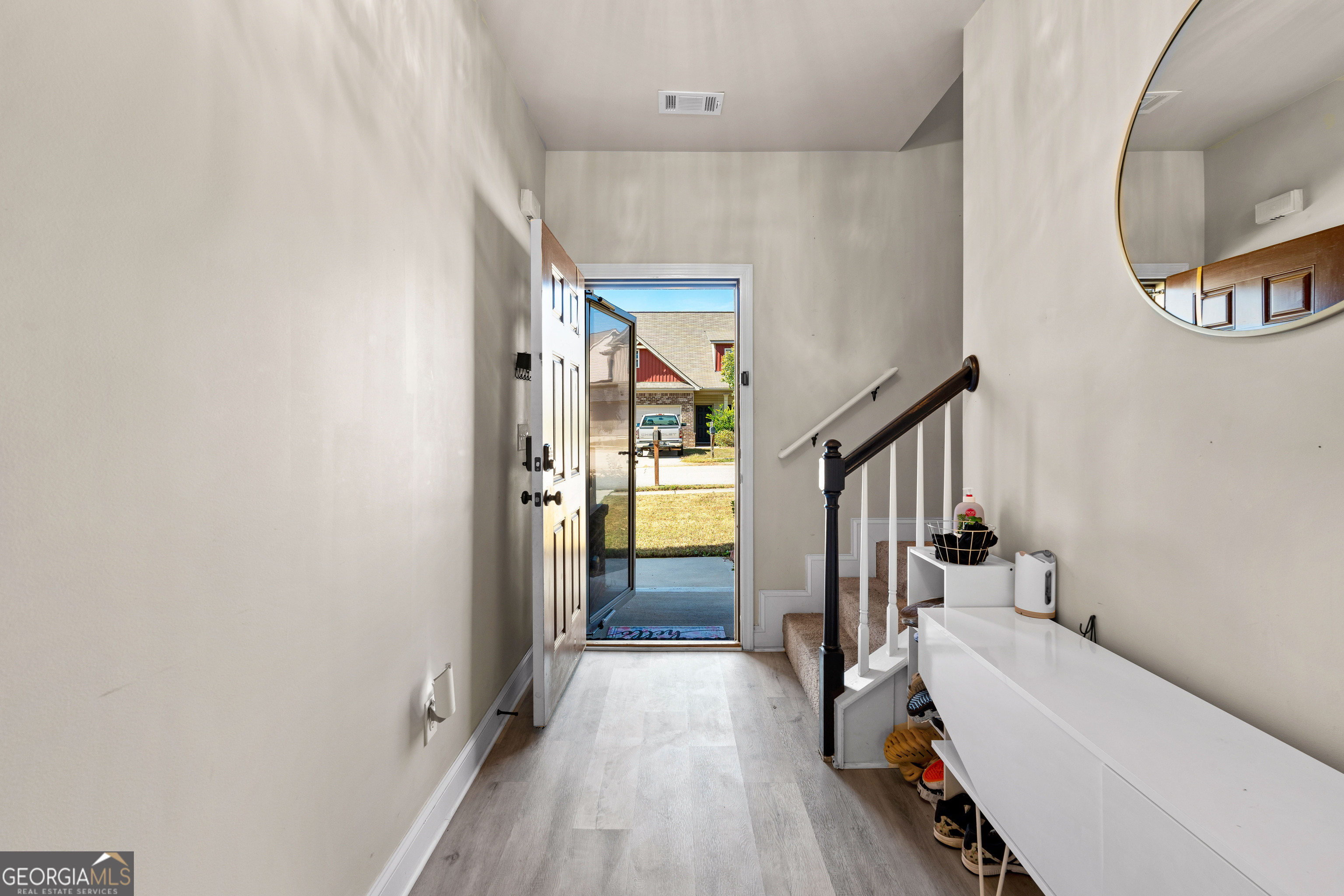 112 Truman Court Jackson, GA 30233 - Photo 5 of 41 a view of a hallway view with staircase and bathroom