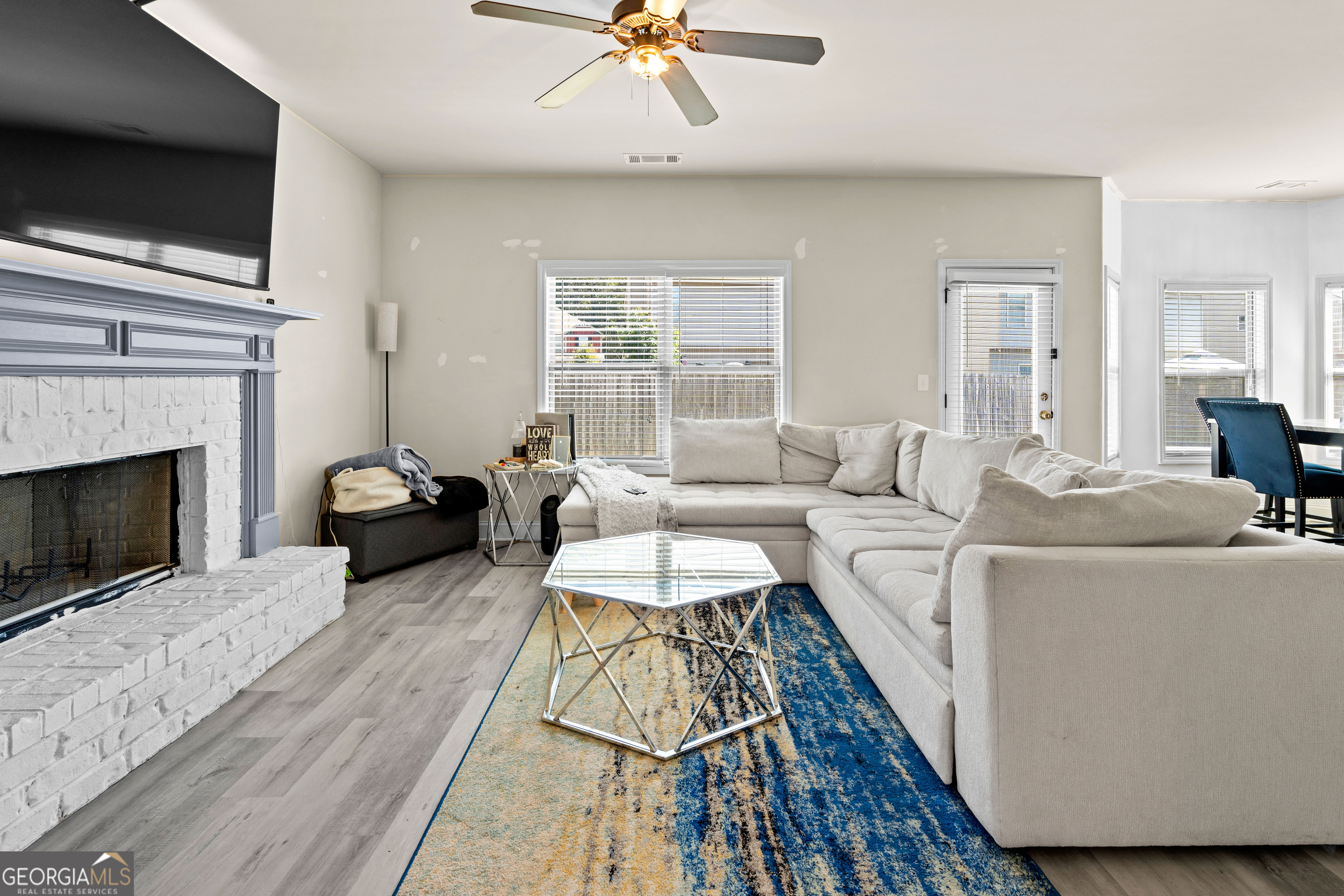 112 Truman Court Jackson, GA 30233 - Photo 8 of 41 a living room with furniture and a fireplace