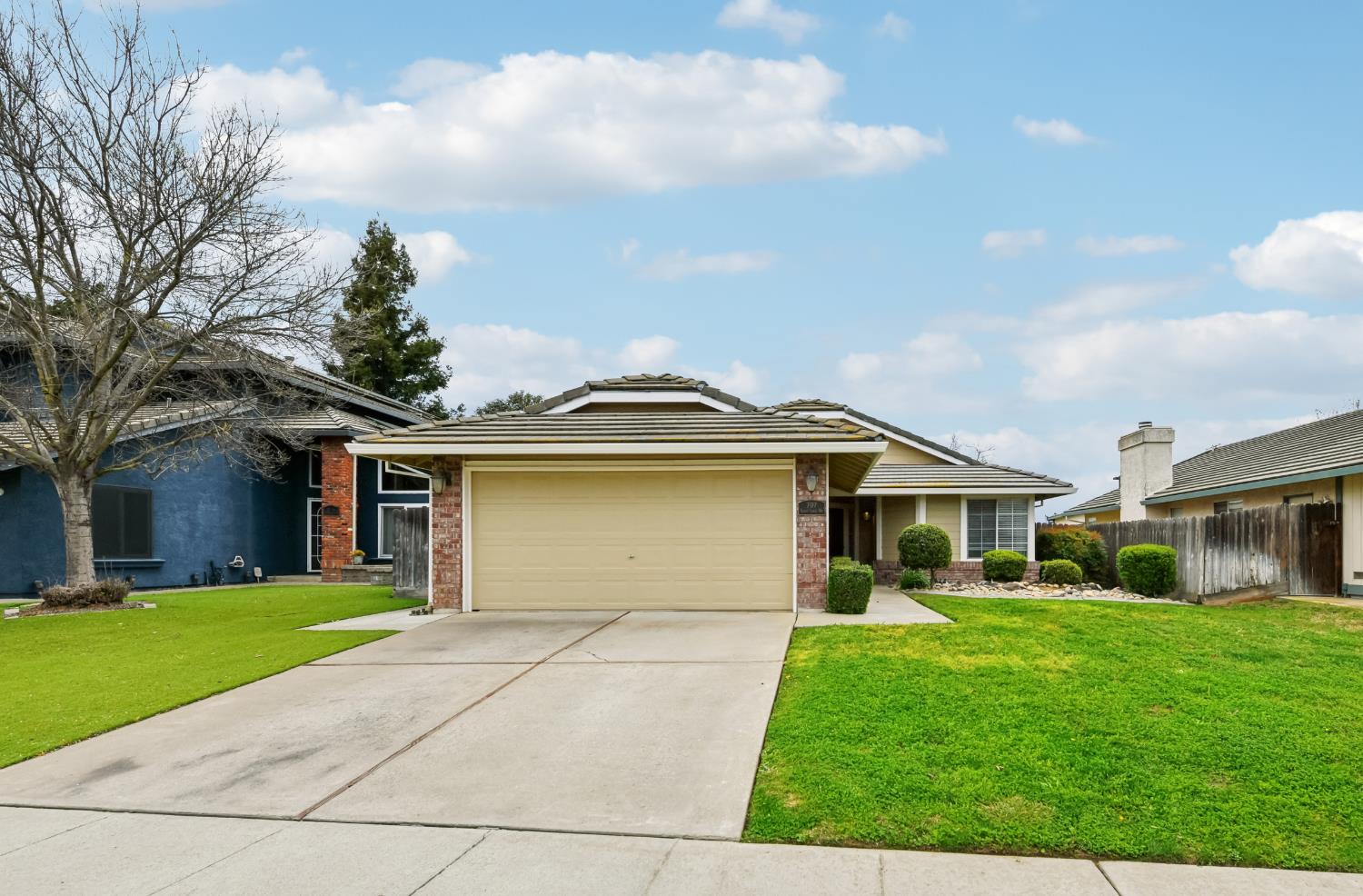 707 Summit Lakes Way Galt, CA 95632 - Photo 1 of 1 a front view of a house with a yard and garage