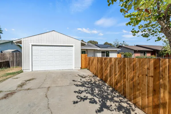 a front view of a house with a garage