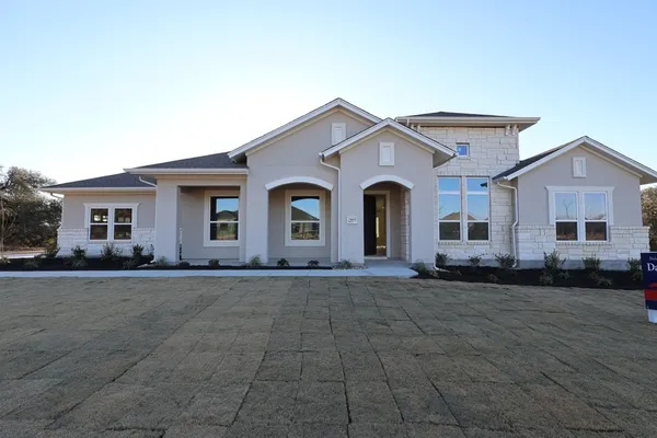 a view of a white house with a outdoor space