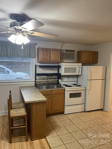 1845 B Bechtler Road Edgemoor, SC 29712 - Photo 4 of 7 a kitchen with a stove microwave and a refrigerator