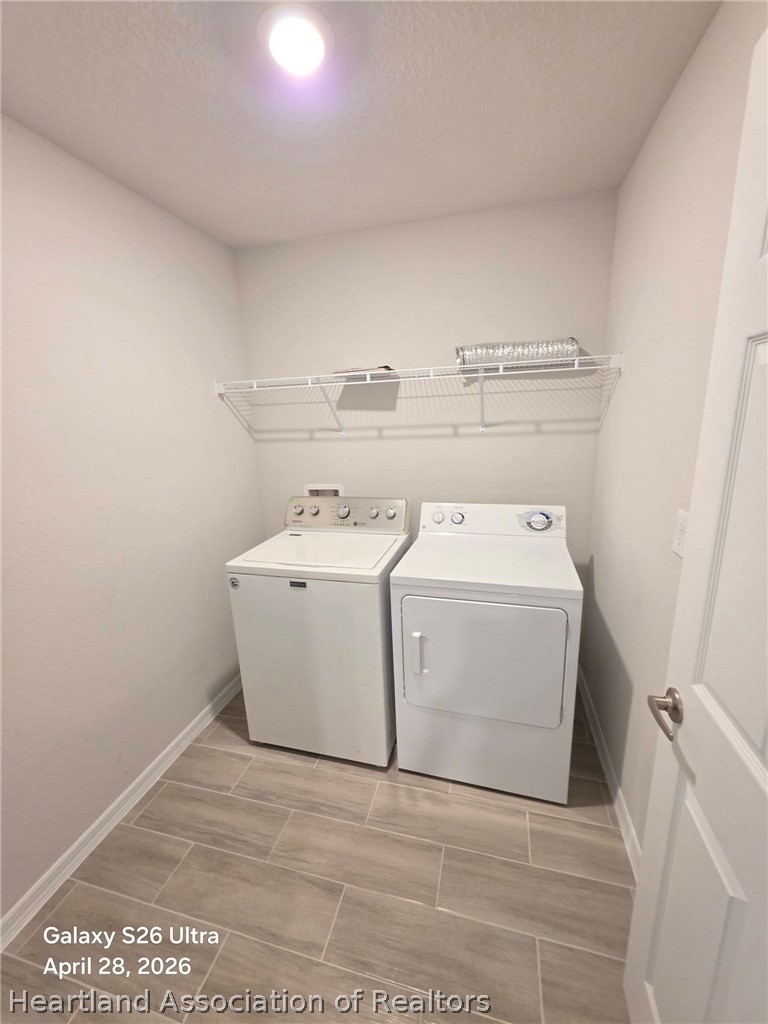 1613 Marble Street Sebring, FL 33870 - Photo 20 of 20 a utility room with dryer and washer