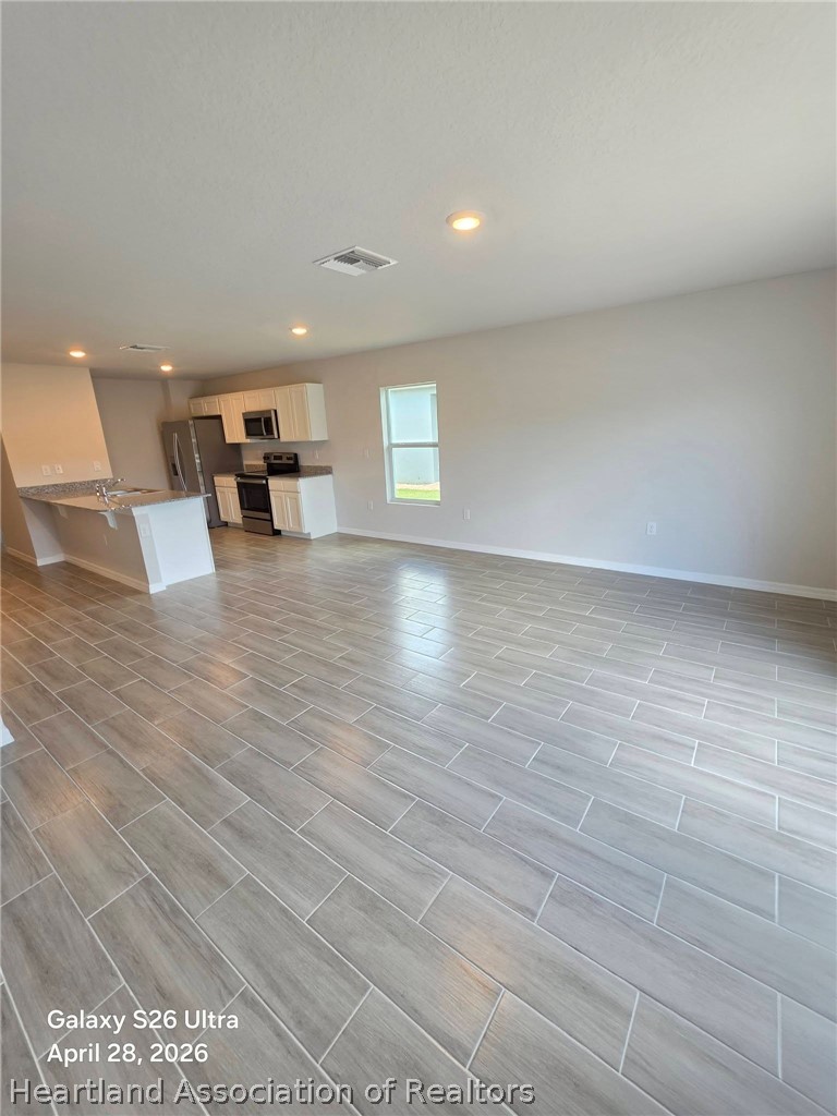 1613 Marble Street Sebring, FL 33870 - Photo 2 of 20 a view of a kitchen with a sink