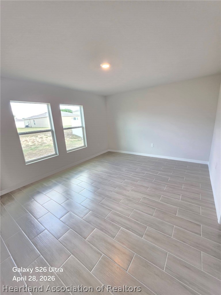 1613 Marble Street Sebring, FL 33870 - Photo 9 of 20 an empty room with windows