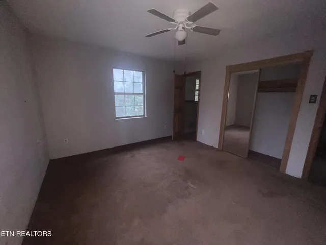 a view of empty room with windows