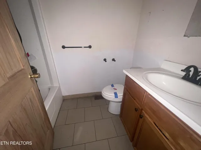 a bathroom with a sink and toilet