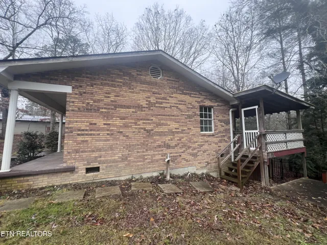 a backyard of a house with seating space