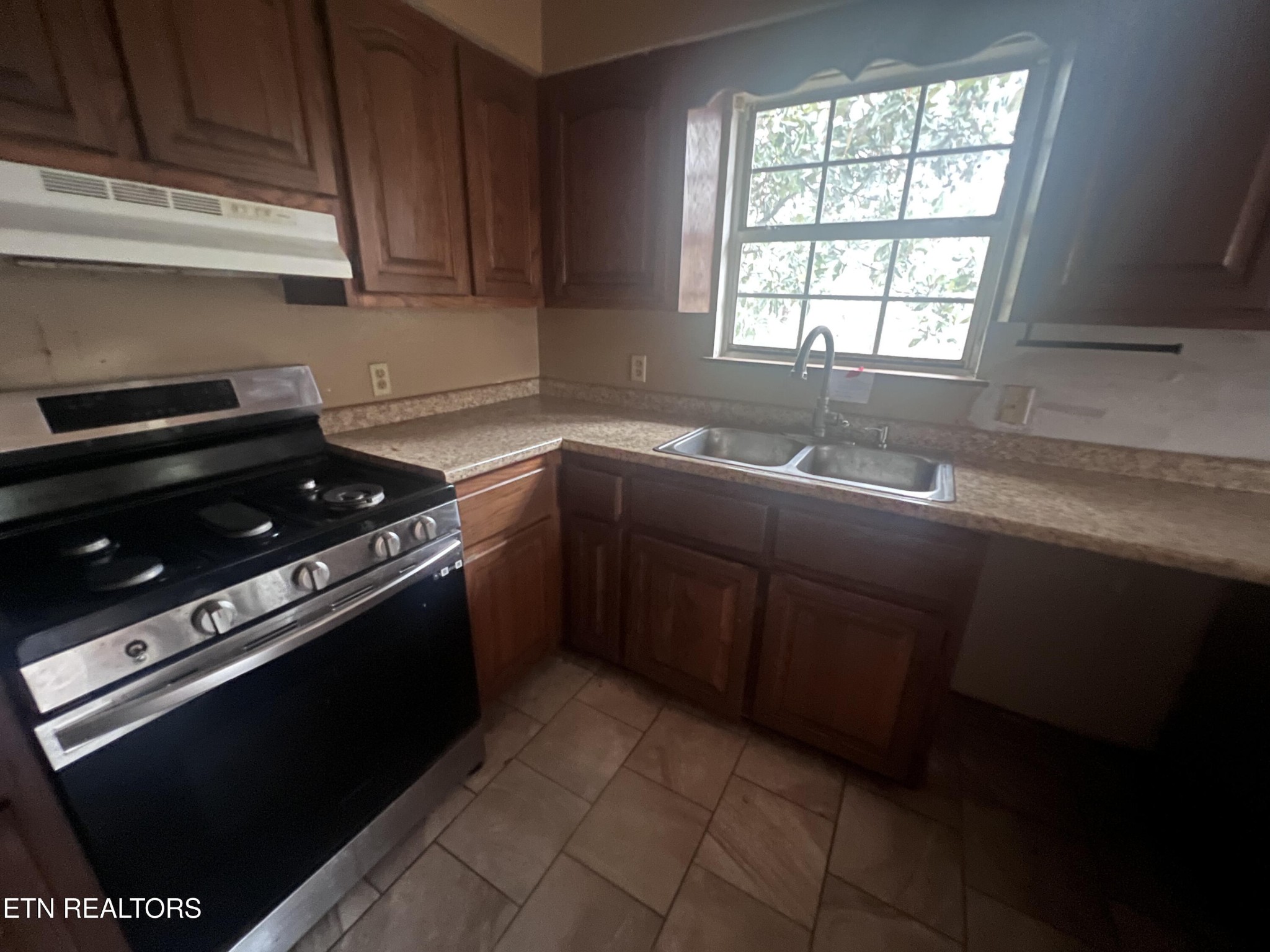 720 Poplar Lane Winfield, TN 37892 - Photo 7 of 19 a kitchen with a sink stove top oven and cabinets