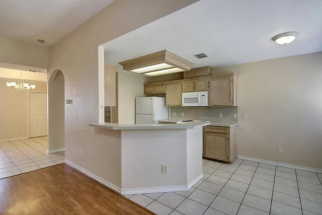 a kitchen with a sink cabinets and appliances