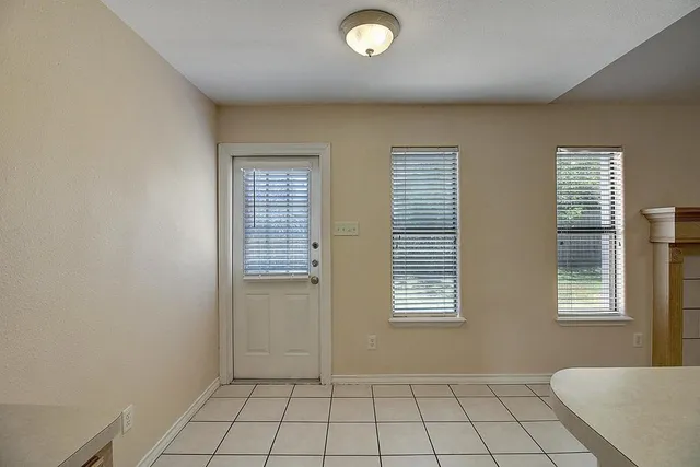 a kitchen that has a sink a stove and a refrigerator