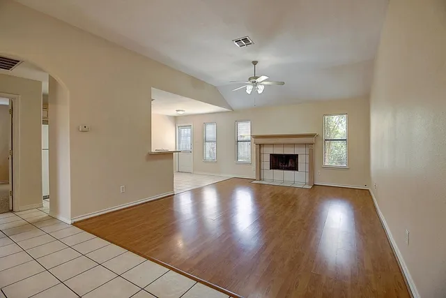 a view of a room with wooden floor and staircase