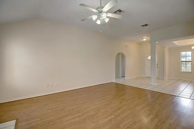 a view of a kitchen with a sink and a stove top oven
