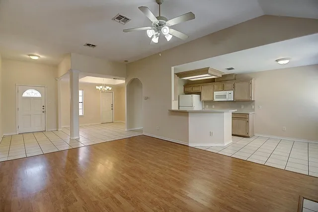 a kitchen with stainless steel appliances granite countertop a sink and a stove top oven