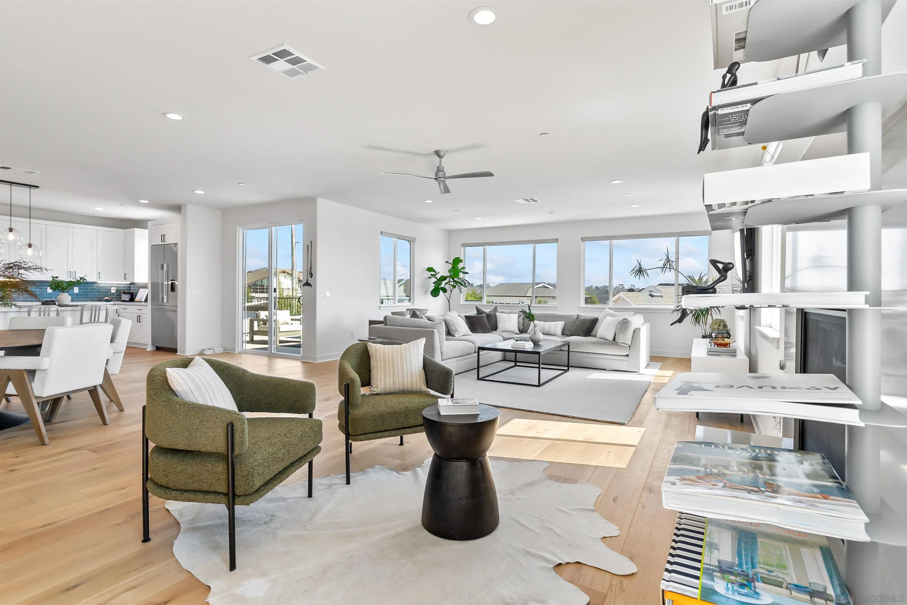 1856 Avocado Road Oceanside, CA 92054 - Photo 11 of 45 a living room with lots of furniture and a view of kitchen