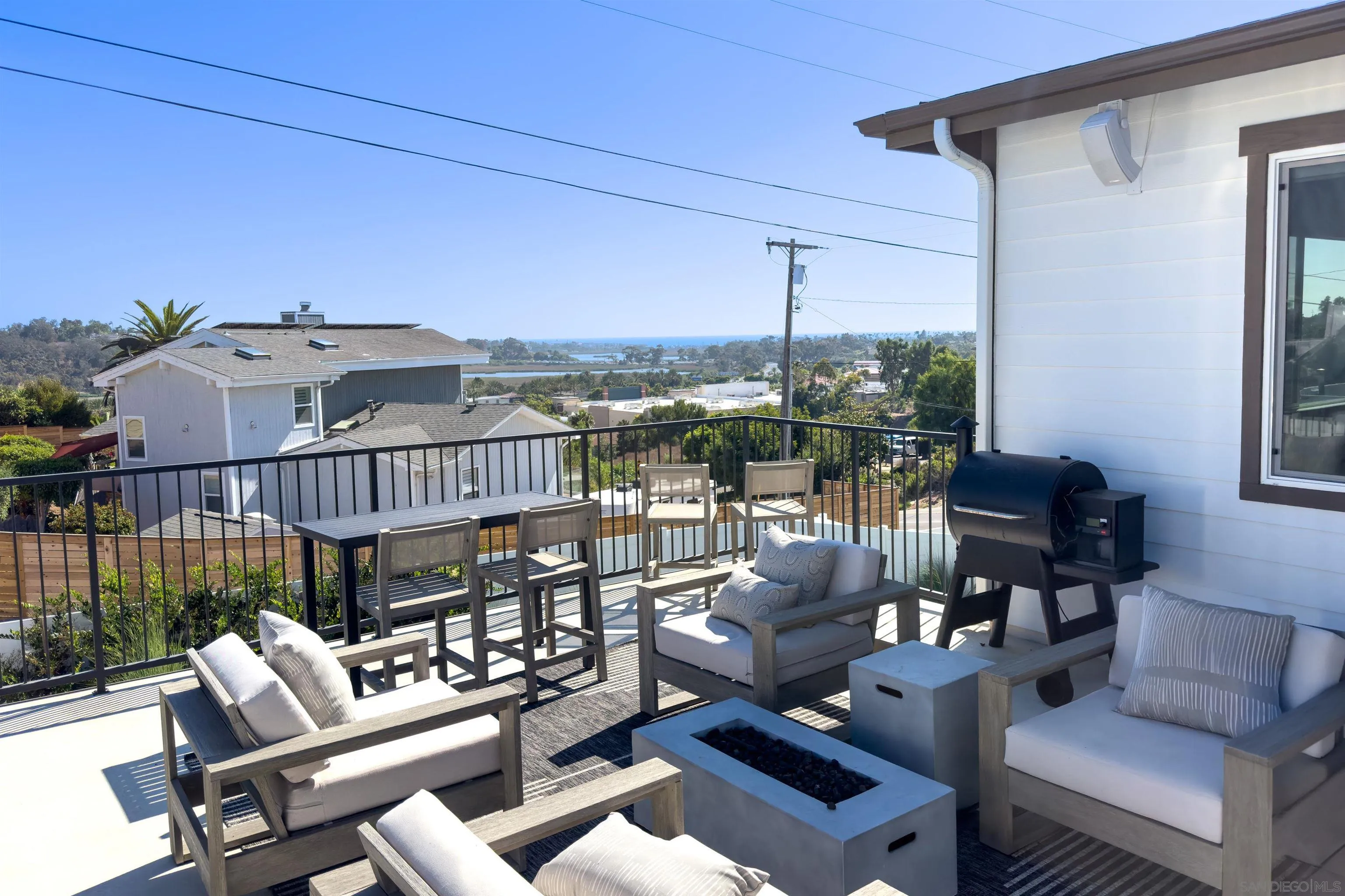 1856 Avocado Road Oceanside, CA 92054 - Photo 13 of 45 a roof deck with couches and potted plants