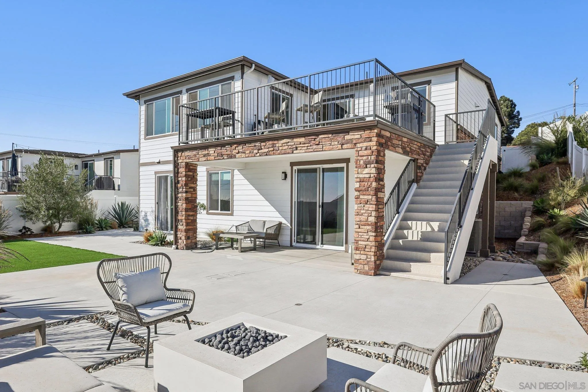 1856 Avocado Road Oceanside, CA 92054 - Photo 35 of 45 a view of a patio with table and chairs with wooden floor and fence